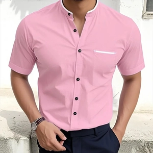 Close-up of pink stand-collar short sleeve shirt with white trim and black buttons