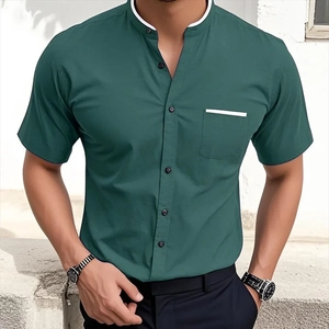 Detail of dark green stand collar shirt with white trim and chest pocket detail