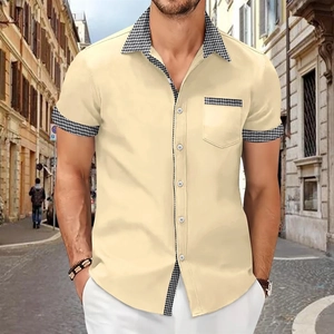Detail of houndstooth patchwork on the collar and pocket of a men's short sleeve shirt
