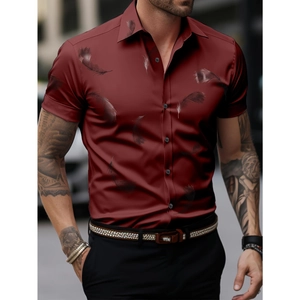 Detailed view of dark red men's short sleeve shirt featuring black feather print patterns