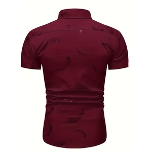 Detail view of the back of a dark red men's short sleeve shirt with feather patterns