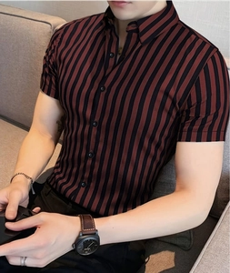 Detail of men's short sleeve shirt with red and black vertical stripes and button closure