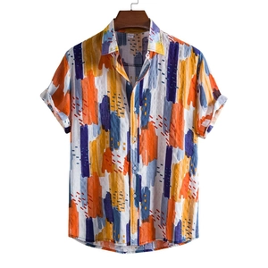 Detailed macro view of the abstract art print texture on this men's short sleeve shirt