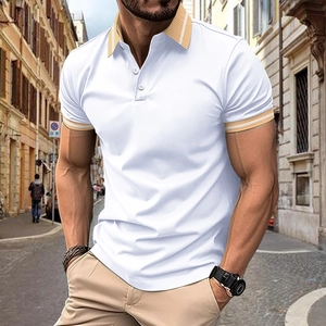 Detail of white men's polo shirt featuring contrasting beige striped collar and cuffs