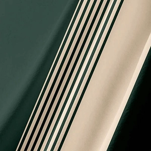 Close-up detail of smooth forest green and beige striped fabric texture on men's casual shirt