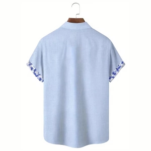 Rear view of light blue linen shirt featuring delicate blue floral prints on the sleeve cuffs