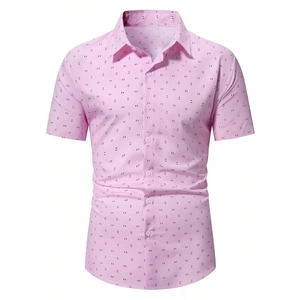 Close-up of pink men's short sleeve shirt featuring detailed dark geometric prints