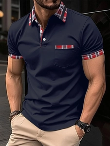 Men's navy blue slim fit polo shirt with plaid trim on collar, cuffs and front pocket