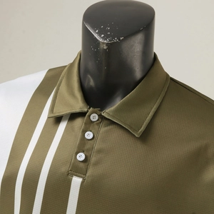 Macro detail of men's polo shirt featuring olive green waffle fabric and white stripes