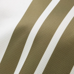 Macro shot of breathable waffle knit fabric with olive green and white stripes