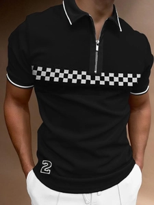 Detail view of men's black polo shirt with zipper neck, checkerboard stripe, and number 2 patch