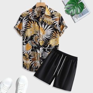 Flat lay of men's tropical print short sleeve shirt and black drawstring shorts set