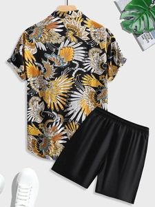 Flat lay of men's tropical feather print shirt and black shorts with summer accessories