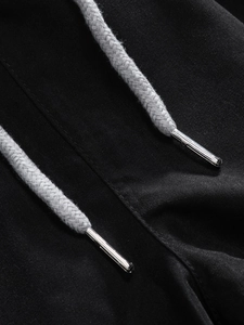 Macro detail of high-quality grey braided drawstring with premium silver metal tips on fabric