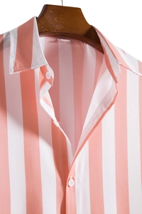 Close-up of pink and white striped shirt collar and white buttons on a wooden hanger
