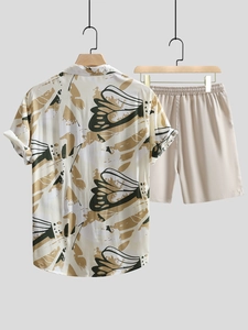 Close-up of men's summer shirt set with abstract butterfly wing prints and elastic shorts
