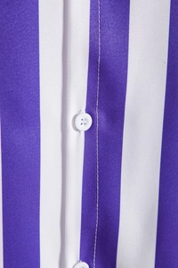 Close-up of fabric texture and button detail on purple and white striped men's shirt