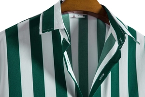 Close-up of green and white vertical striped shirt collar with M-size label on hanger