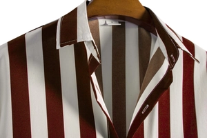 Close-up of a striped short-sleeve shirt collar and size M label on a wooden hanger