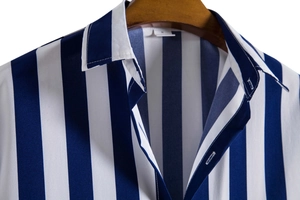 Detail of blue and white striped shirt collar on wood hanger with size M tag