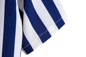 Close-up of the stitching and fabric on the blue and white vertical striped shirt sleeve