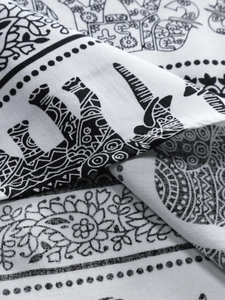 Macro view of bohemian elephant pattern and ethnic floral print on cotton linen fabric