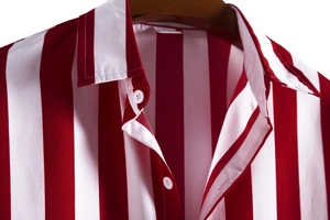 Close-up of red and white vertical striped men's casual shirt with white buttons