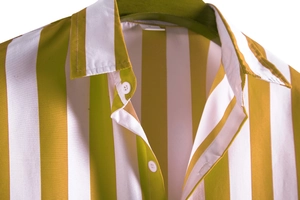 Close-up of olive green and white vertical striped shirt with white buttons and linen texture