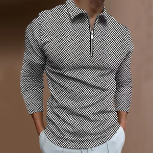 Detail of men's polo shirt featuring black and white 3D geometric patterns and half-zip collar