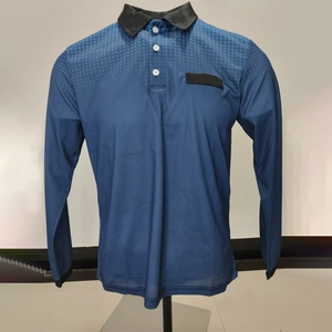 Detail of navy long sleeve polo shirt with black collar and blue gradient dot pattern