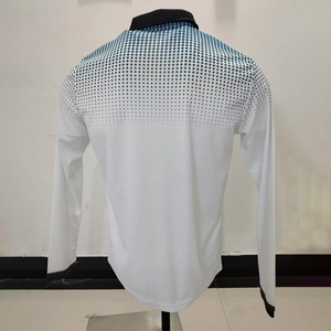 Detail of white long sleeve polo shirt showing blue gradient dot pattern on the back