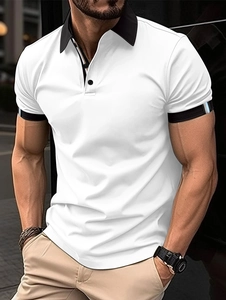 Detail of white cotton polo shirt with black contrast collar and ribbed striped cuffs