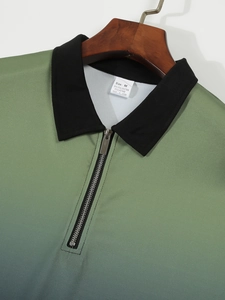 Detail of green gradient polo shirt collar with silver metal zipper and fabric texture