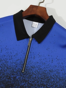 Macro shot of men's polo shirt zipper collar with blue and black ink splatter print