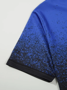 Close-up of blue gradient polo shirt sleeve showing honeycomb mesh fabric and spot pattern