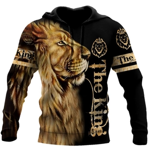 Close-up of realistic 3D lion print and The King text on black drawstring hoodie