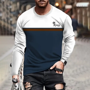 Close-up of three-color block long sleeve tee with King print and crown detail