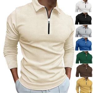Close-up of men's long sleeve polo shirt featuring waffle texture fabric and 1/4 zip collar