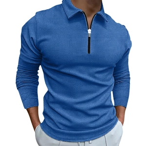 Men's blue waffle knit long sleeve polo shirt with zipper collar and casual texture