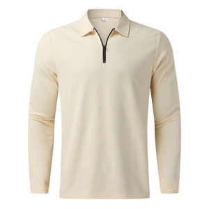 Detail of waffle knit fabric and contrasting zipper on beige long sleeve polo shirt
