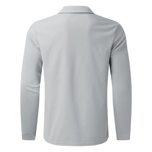 Detail view of the back of a light grey waffle knit polo shirt with a classic collar