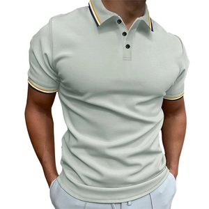 Close-up of contrast striped ribbed collar and button detail on men's slim fit polo shirt
