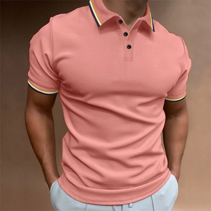 Detail of coral pink polo shirt featuring striped rib collar and three black buttons