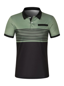 Close-up of contrast polo shirt featuring green stripes, black collar and button detail