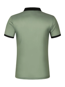 Detail view of the back of a sage green polo shirt with black contrast ribbed trim and mesh texture