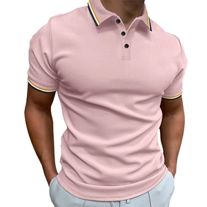 Close-up of the light pink polo shirt featuring ribbed knit texture and striped collar detail