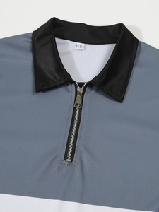 Détail du col zippé pour polo homme et tissu en maille respirante gris et noir