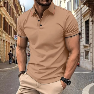 Detail of khaki polo shirt featuring red stitching on collar and ribbed contrast cuffs