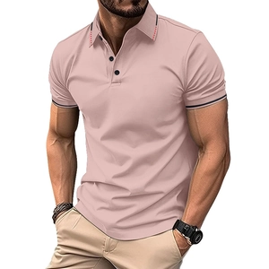Detail of pink polo shirt featuring a ribbed collar with red accents and black sleeve cuffs