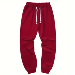 Men's high street joggers in deep red with elastic waistband and white drawstrings